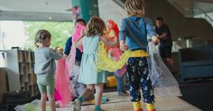group of young children joining in the workshop