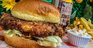 Burger and chips, with ginger beer in the background
