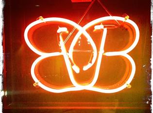 Brightly lit neon sign of the B-bar