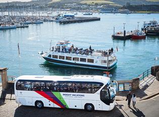 Coach party enjoying a cruise in front of the Mayflower Steps