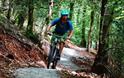 Cyclist riding through Drakes Trail.