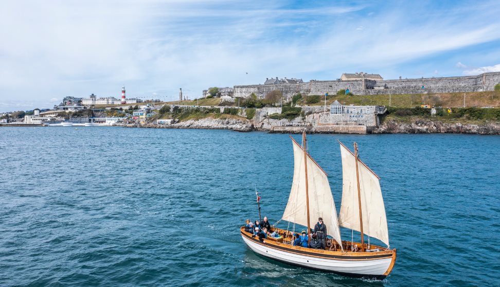 Boat sailing across Plymouth Sound