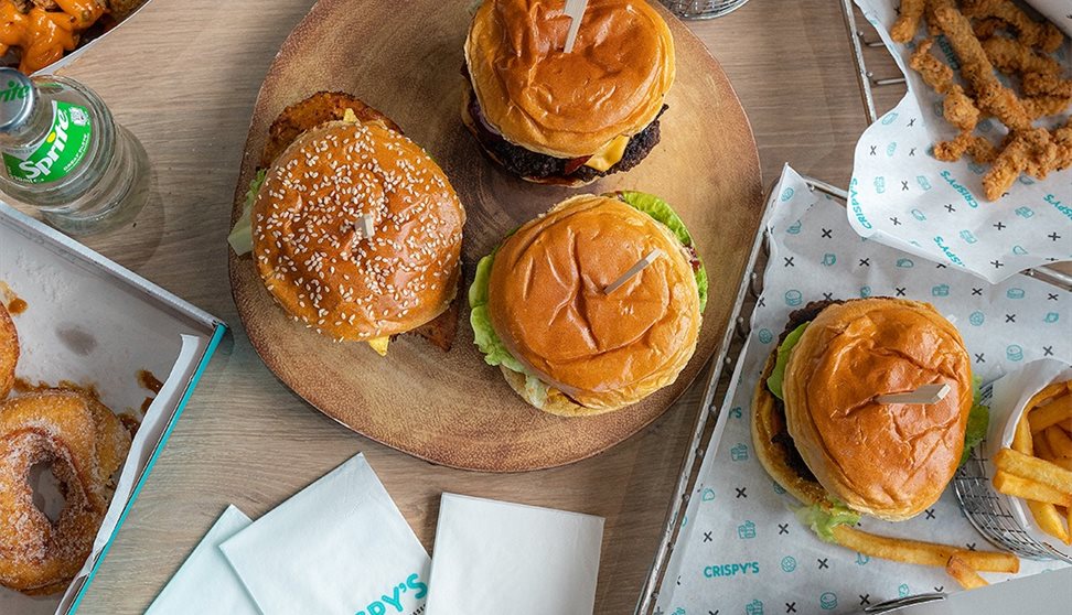 Platter of burgers, fries and sides