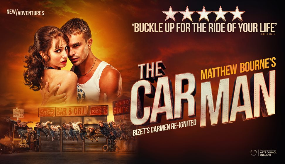 Man and Woman embrace, looking towards camera. The backdrop is steamy and orange.