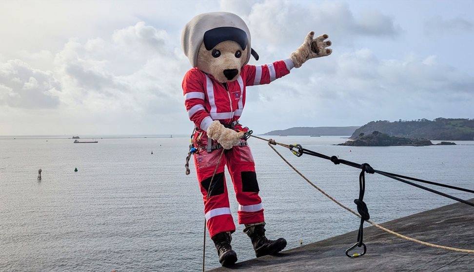 DAA Mascot, Ambrose, ready to abseil down a wall.