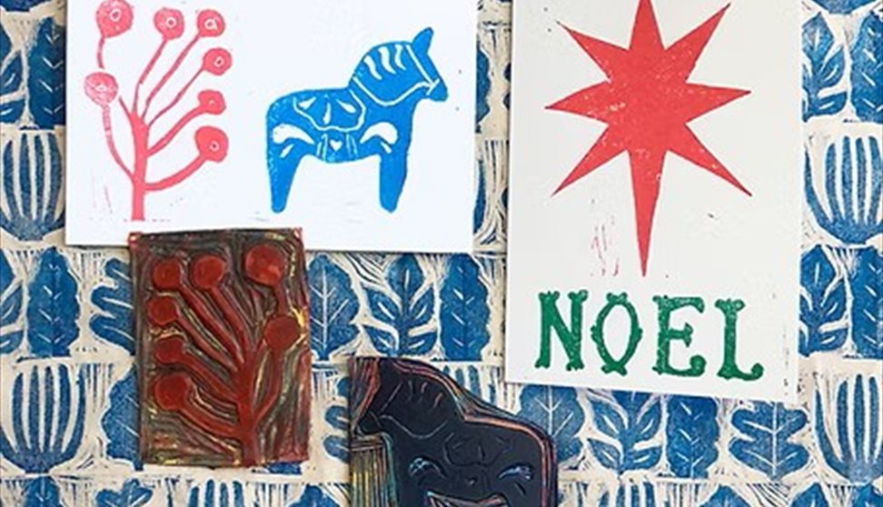 A selection of Christmas block printed images on white card (Credit Grace Coombs)