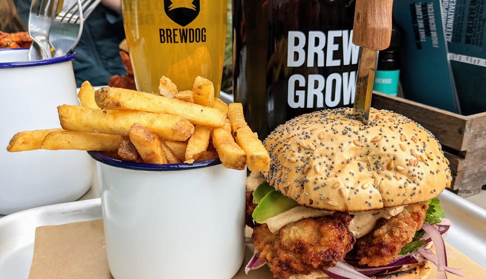 Cup of fries, burger and pint of BrewDog