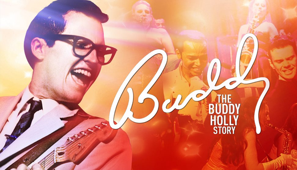 Colourful image of Buddy Holly with guitar
