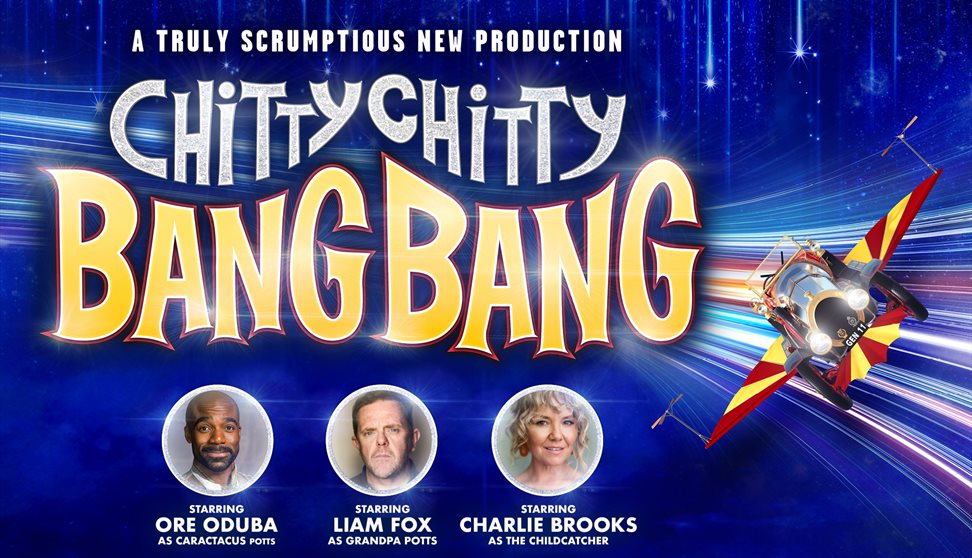 Blue backdrop with flying chitty car and cast members, Ore Oduba, Liam Fox and Charlie Brooks.
