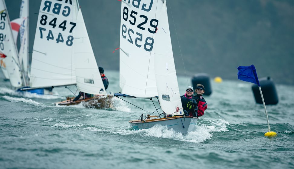 Boats race on water in Plymouth Sound