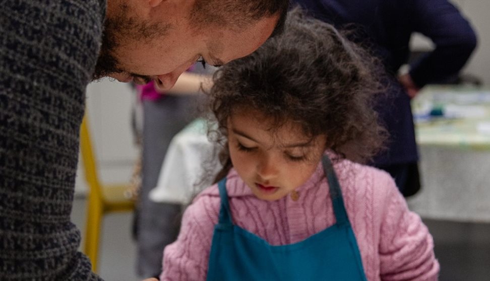 A young girl takes part in a craft activity