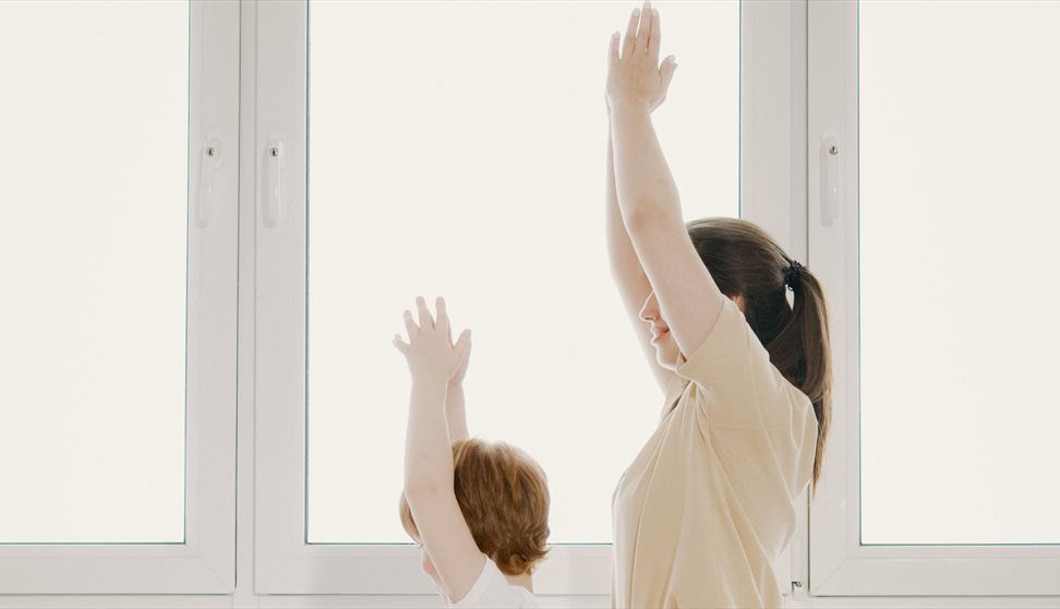 A mother and child taking part in a yoga session