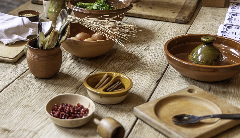 An array of ingredients in bowls set out on a wooden table