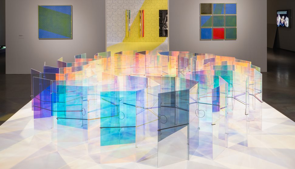 Photograph showing a colourful sculpture installation in a gallery