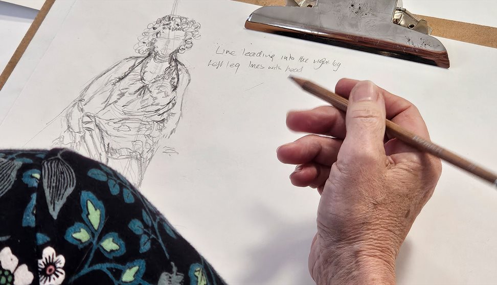 A woman takes part in a life drawing workshop