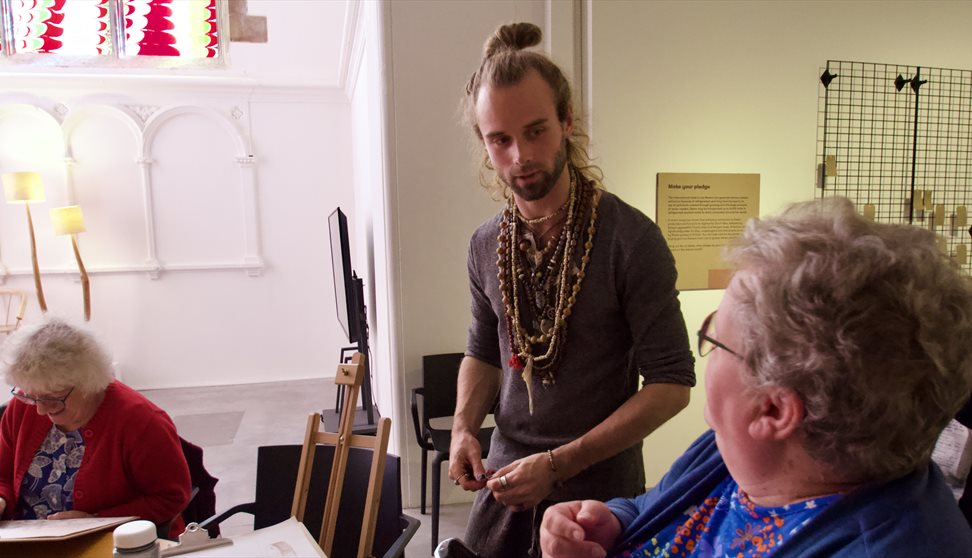 Photograph showing people taking part in an artist workshop