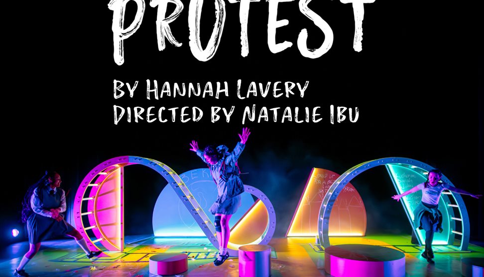 Protest is written as if painted in white on a blue background. To the right three young girls are shown in bright colours. Two stand, one holding a m