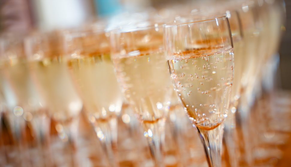 a close up detail of glasses of prosecco