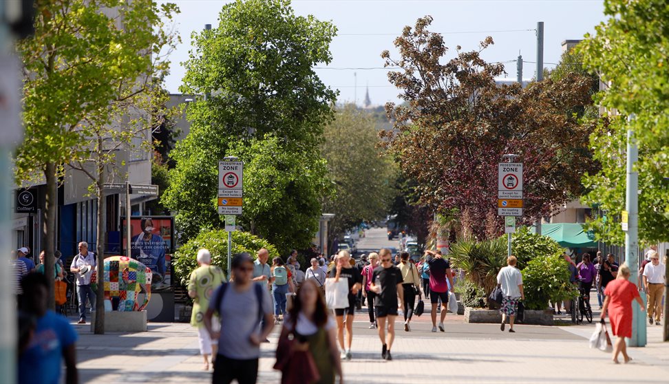 Shoppers walking down the street in Plymouth City Centre