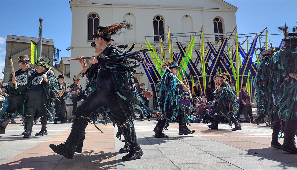 Photograph showing a group of Morris Dancers outside The Box in Plymouth