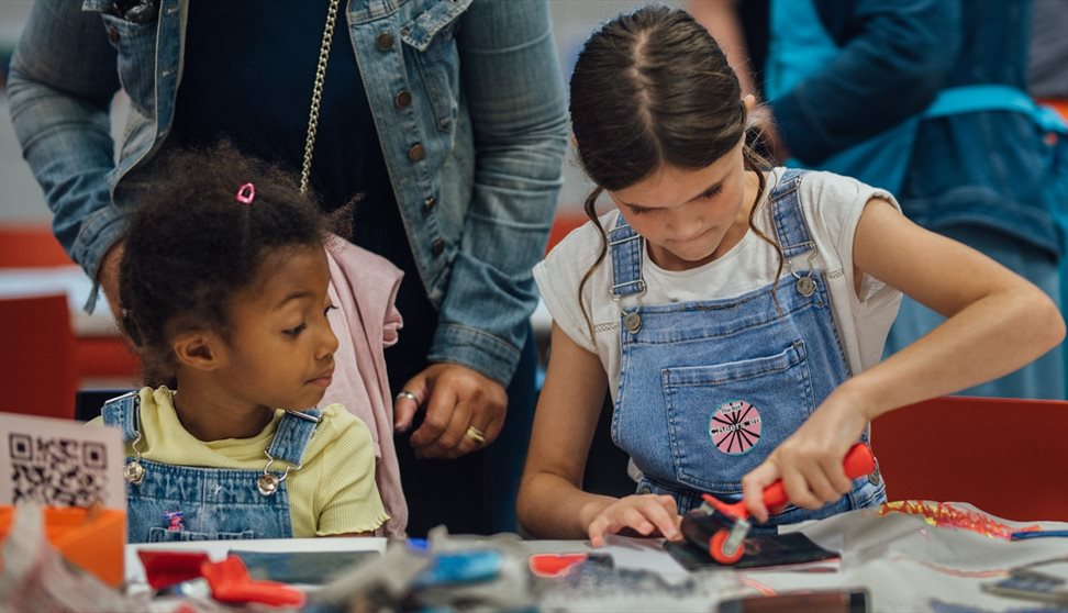 Two girls take part in a craft activity