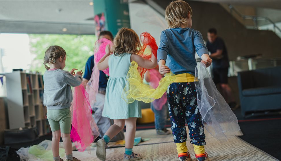 group of young children joining in the workshop