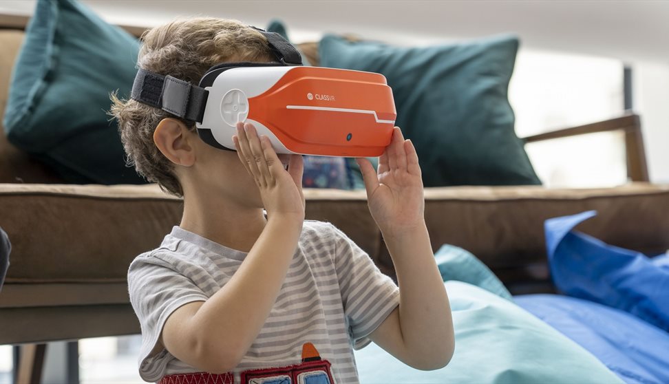 little boy wearing a VR headset