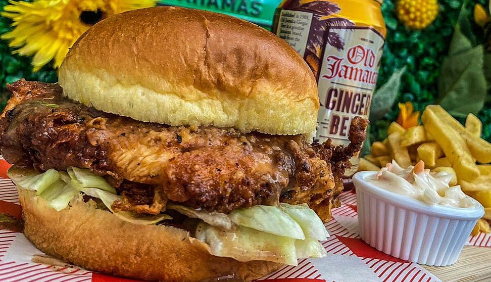 Burger and chips, with ginger beer in the background