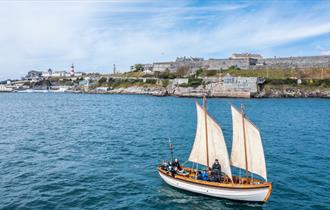 Boat sailing across Plymouth Sound