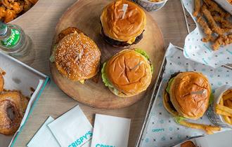 Platter of burgers, fries and sides