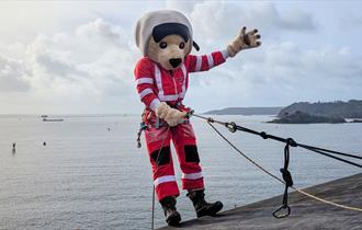 DAA Mascot, Ambrose, ready to abseil down a wall.