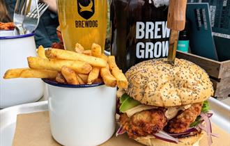 Cup of fries, burger and pint of BrewDog