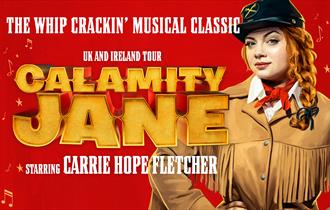 Carrie Hope-Fletcher as Calamity. Red backdrop.