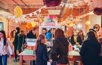 Visitors at Design to Sell, the annual makers market at Arts University Plymouth's Pre-Degree campus