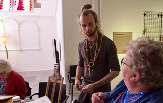 Photograph showing people taking part in an artist workshop