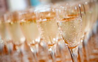 a close up detail of glasses of prosecco
