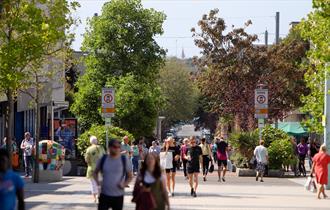 Shoppers walking down the street in Plymouth City Centre