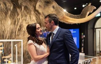 Photograph showing a bride and groom in the Mammoth Gallery at The Box