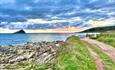 The mewstone on a calm sea with cloudy sky