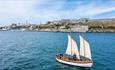 Boat sailing across Plymouth Sound