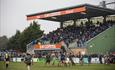 View of Plymouth Albion playing Rugby with spectators watching.