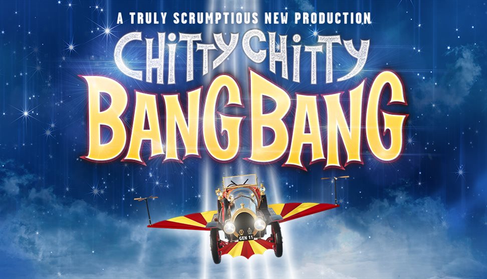 'A Truly Scrumptious New Production' in white font. 'Chitty Chitty' in silver sparkles and 'Bang Bang' in yellow, outlined in red. The backdrop is a b
