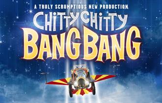 'A Truly Scrumptious New Production' in white font. 'Chitty Chitty' in silver sparkles and 'Bang Bang' in yellow, outlined in red. The backdrop is a b