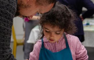 A young girl takes part in a craft activity
