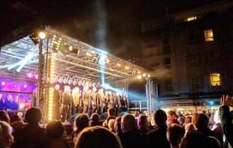 Performers on stage at Plymouth Christmas Lights Switch-on