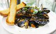 Fishbone Restaurant mussels in white wine sauce with homemade bread