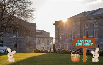 Royal William Yard Lawn with Easter bunnies and a sign saying Easter Egg hunt