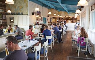 People dining inside Rockfish restaurant