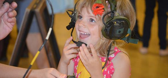 Young girl interacting with the communication equipment