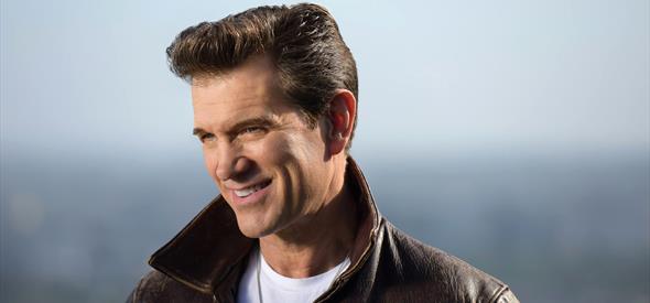 Chris Isaak smiling